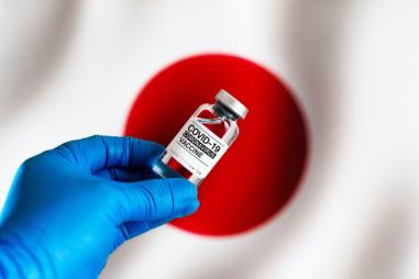 Japanese-flag-and-vaccine-bottle-810x500.jpg