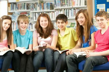 Young-teens-at-library-scaled-e1688648132863-810x500.jpg