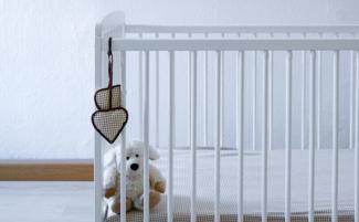 Empty-crib-scaled-e1776432560171.jpg