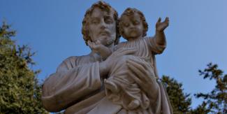web3-saint-st-joseph-statue-baby-infant-child-jesus-blue-sky-shutterstock.jpg